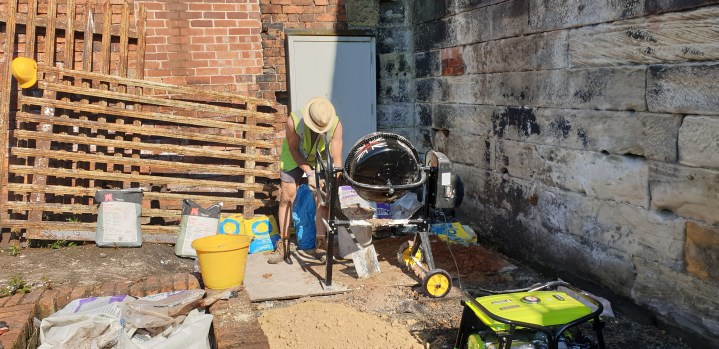 Cement mixer hard at it on lower terrace mixing lime mortar. Cement was also used as a rubble infill binder for collapsed sections