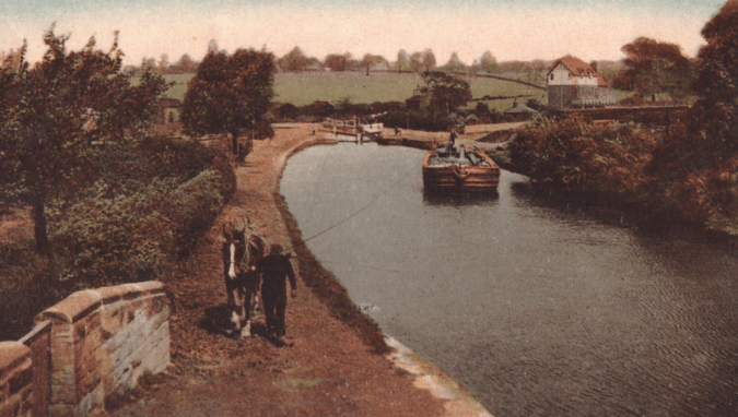 Horse power: a horse draws a barge by rope down the Barnsley Canal (coloured postcard early 20th century)