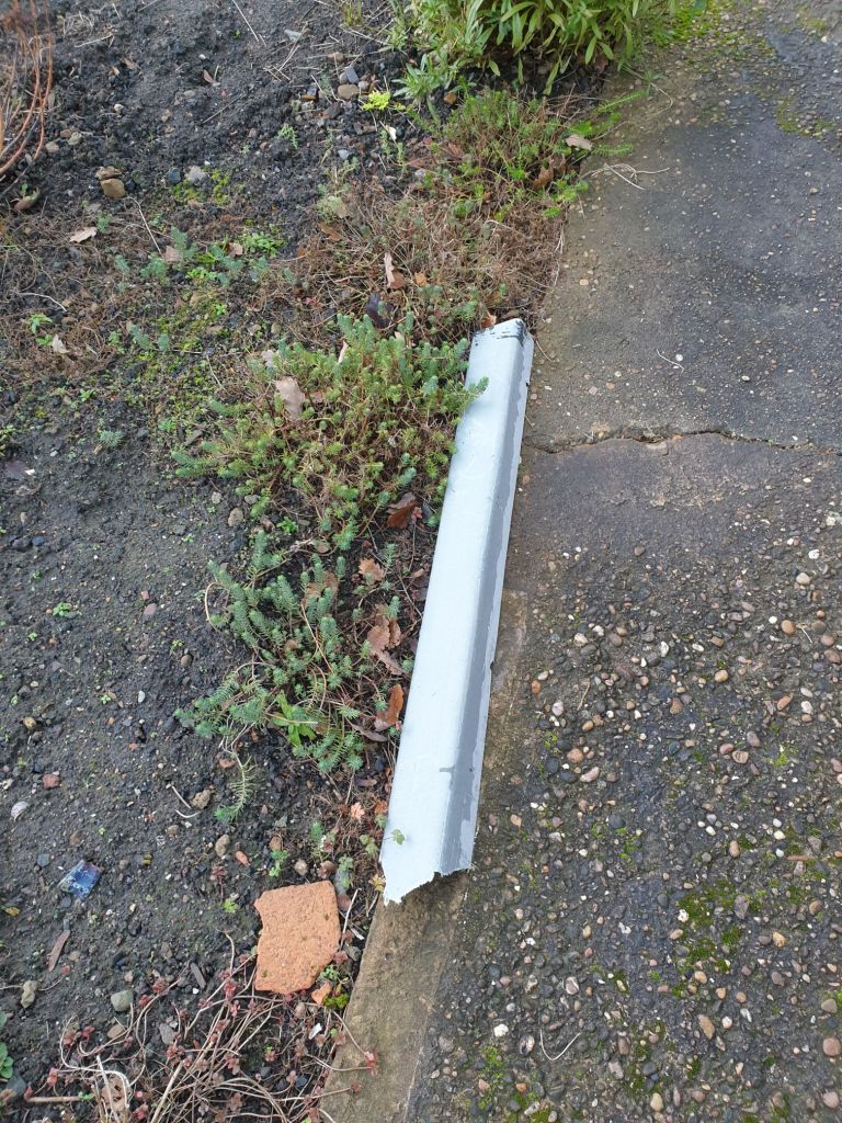 A broken piece of roofing trim on the ground after stormy weather in December 2023 at Hemingfield Colliery